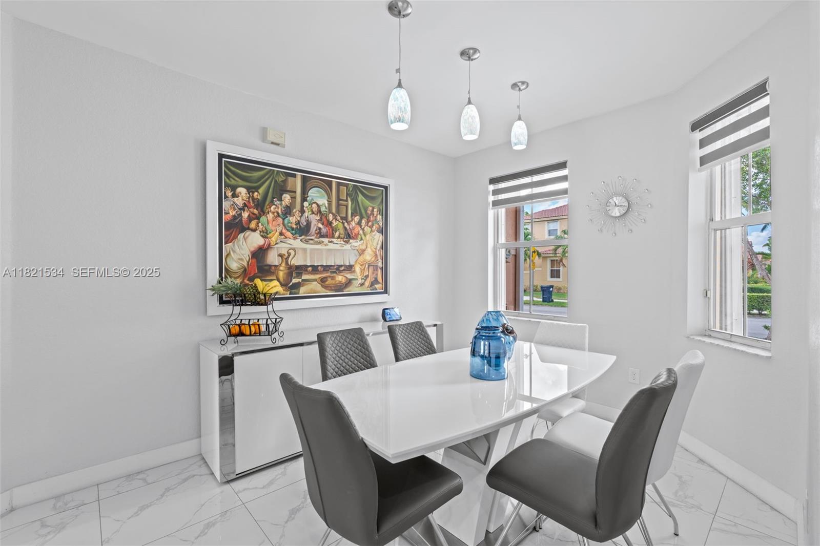 13745 Southwest 113th Lane Miami, FL 33186 - Photo 14 of 53 a view of a dining room with furniture window and wooden floor