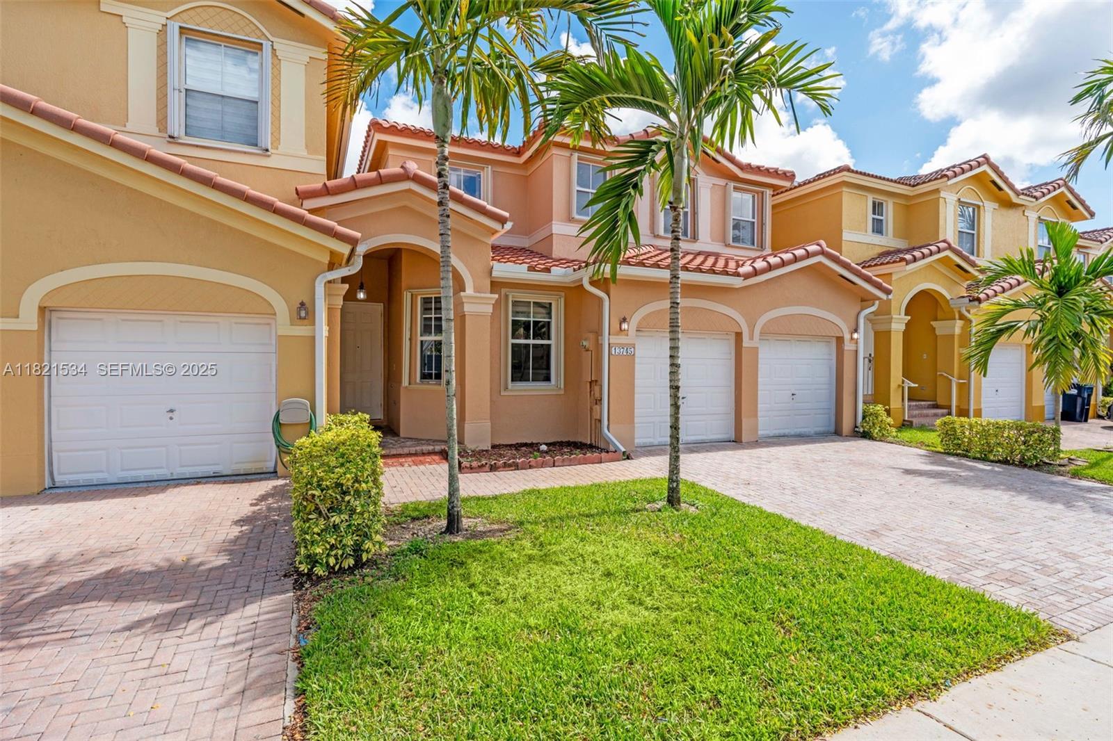 13745 Southwest 113th Lane Miami, FL 33186 - Photo 2 of 53 front view of a house with a yard and palm trees