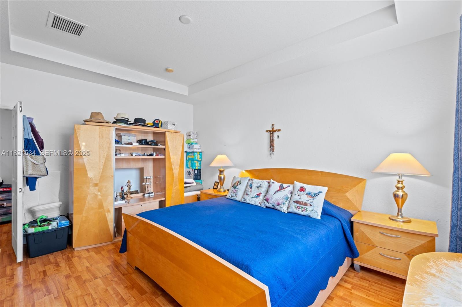 13745 Southwest 113th Lane Miami, FL 33186 - Photo 33 of 53 a bedroom with a bed and wooden floor