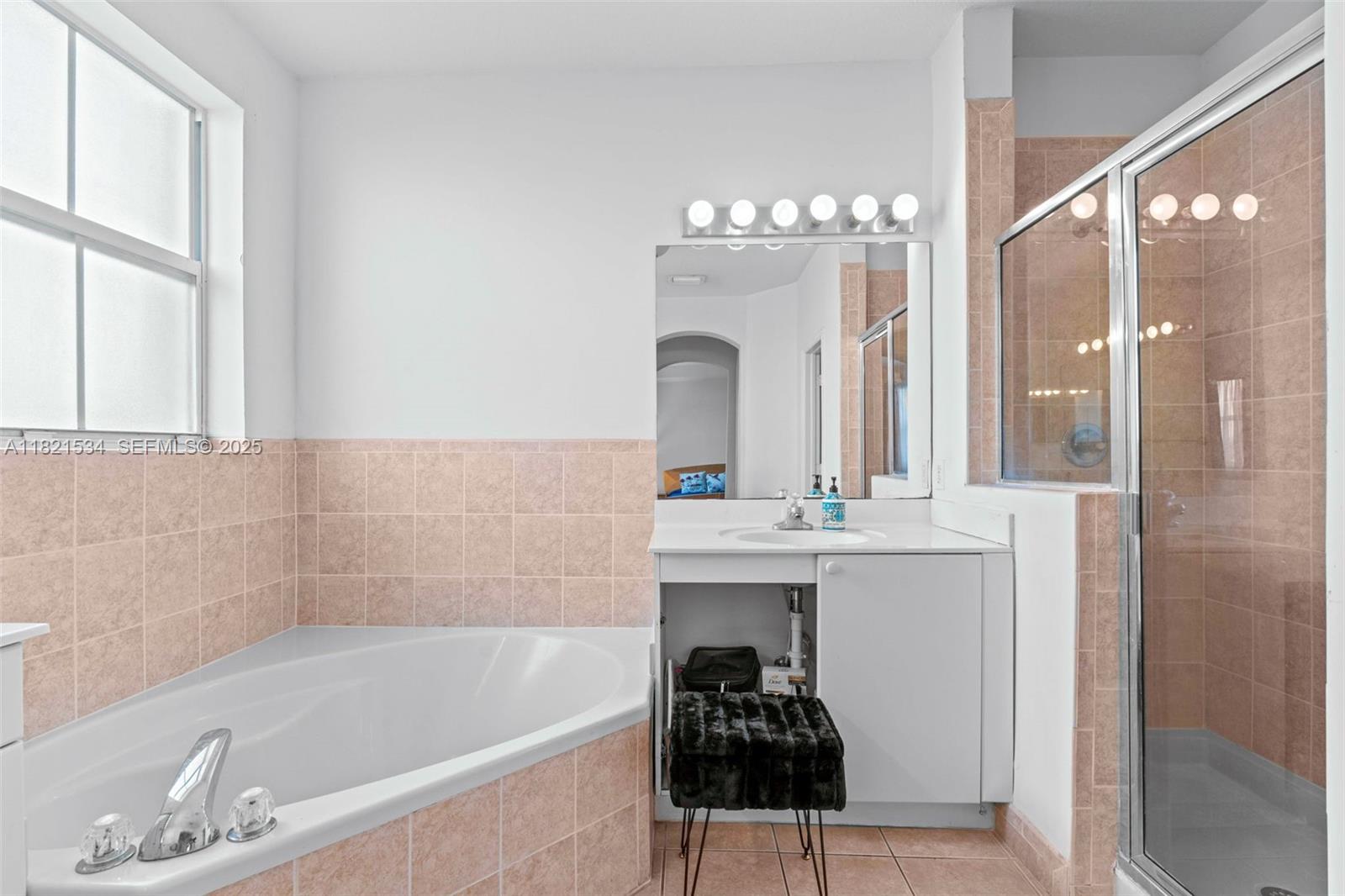 13745 Southwest 113th Lane Miami, FL 33186 - Photo 36 of 53 a bathroom with a bathtub and a sink