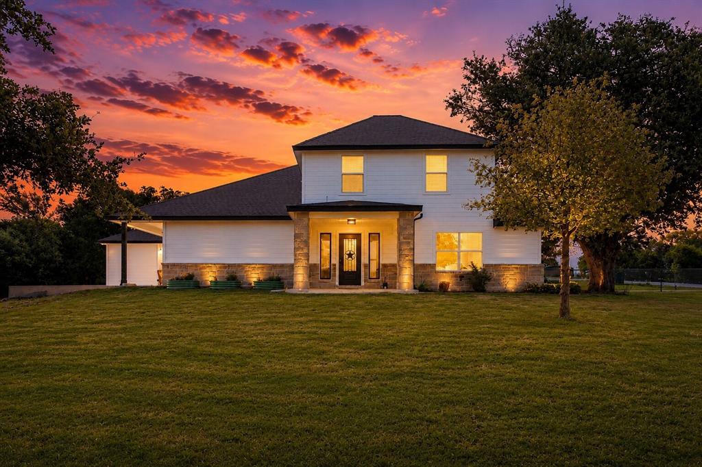 117 Rock Salt Drive Springtown, TX 76082 - Photo 1 of 38 Two-story residence featuring white siding and stone accents