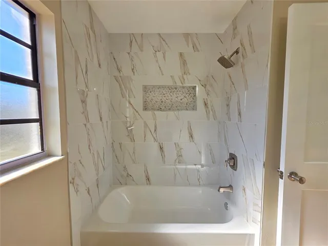 a view of a house with a snow on the road