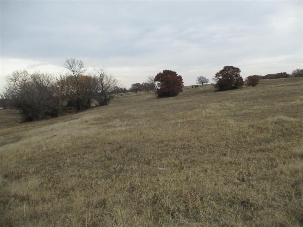 54-ac Huddleston Road Sunset, TX 76270 - Photo 7 of 13 a view of outdoor space with trees