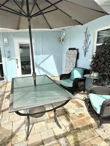 a view of a livingroom with furniture and a kitchen