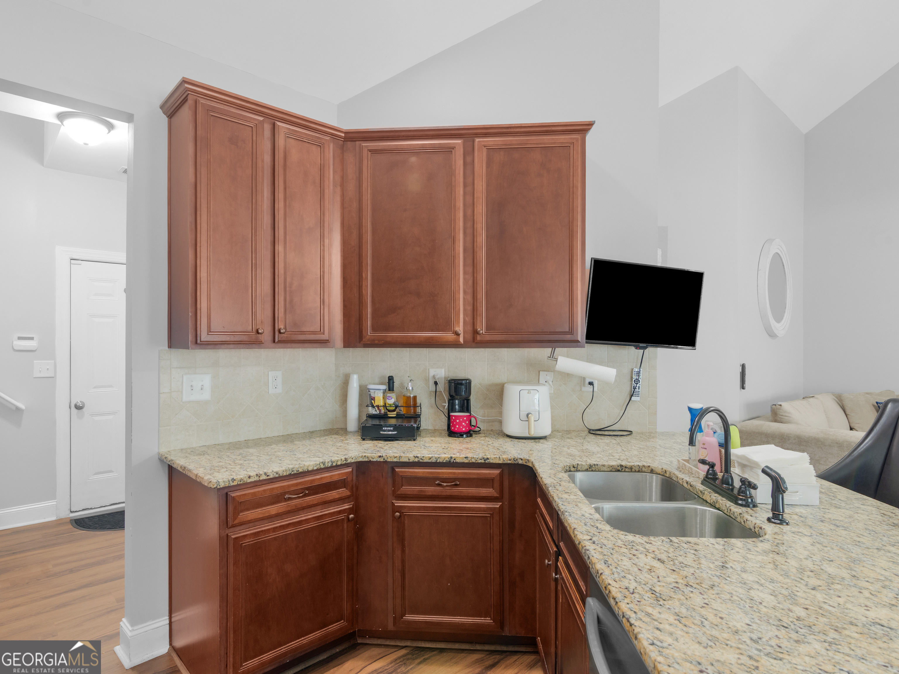 601 Amerigo Court Locust Grove, GA 30248 - Photo 12 of 23 a kitchen with stainless steel appliances granite countertop a sink stove and microwave