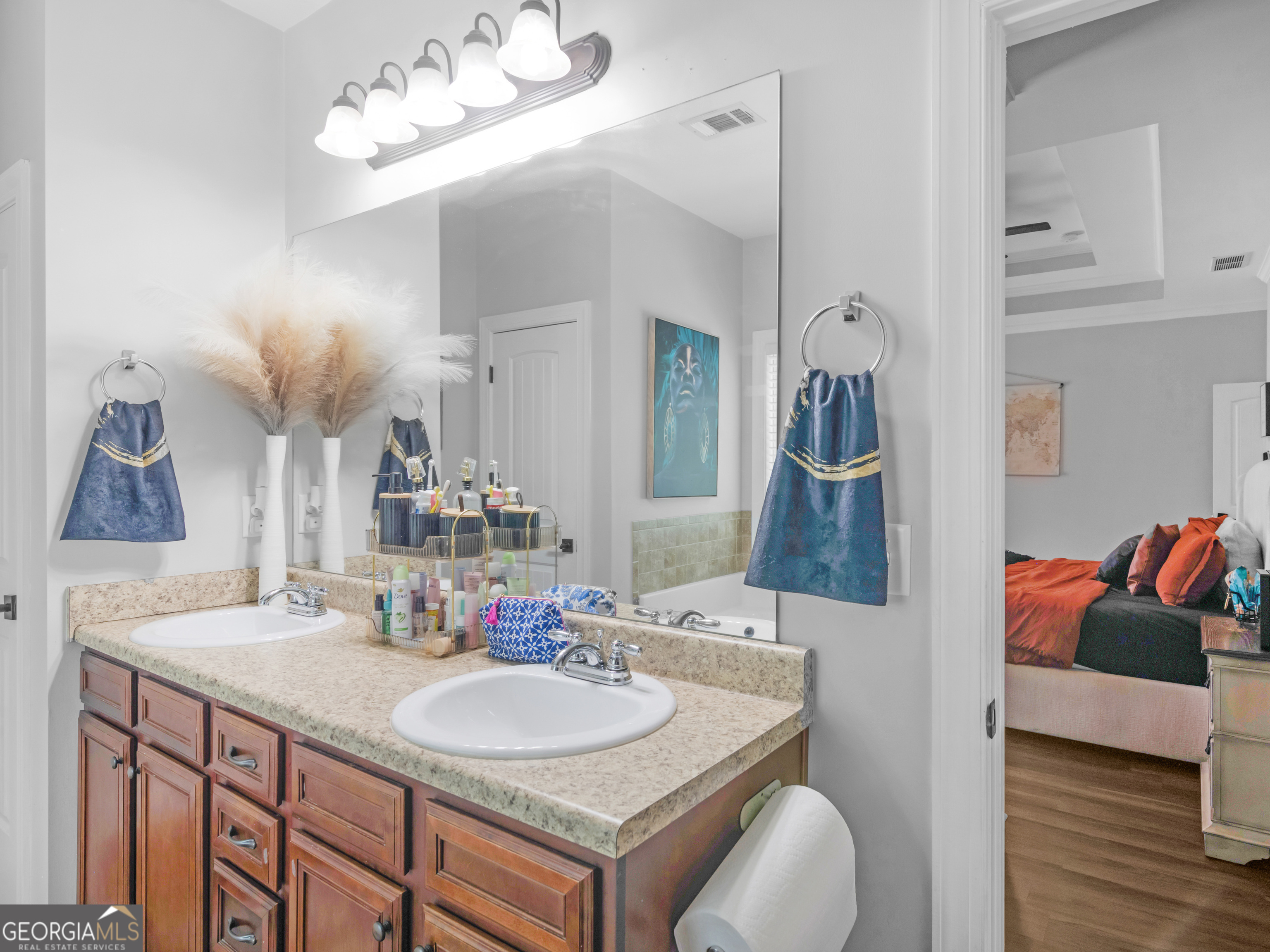 601 Amerigo Court Locust Grove, GA 30248 - Photo 17 of 23 a bathroom with a sink vanity and a mirror