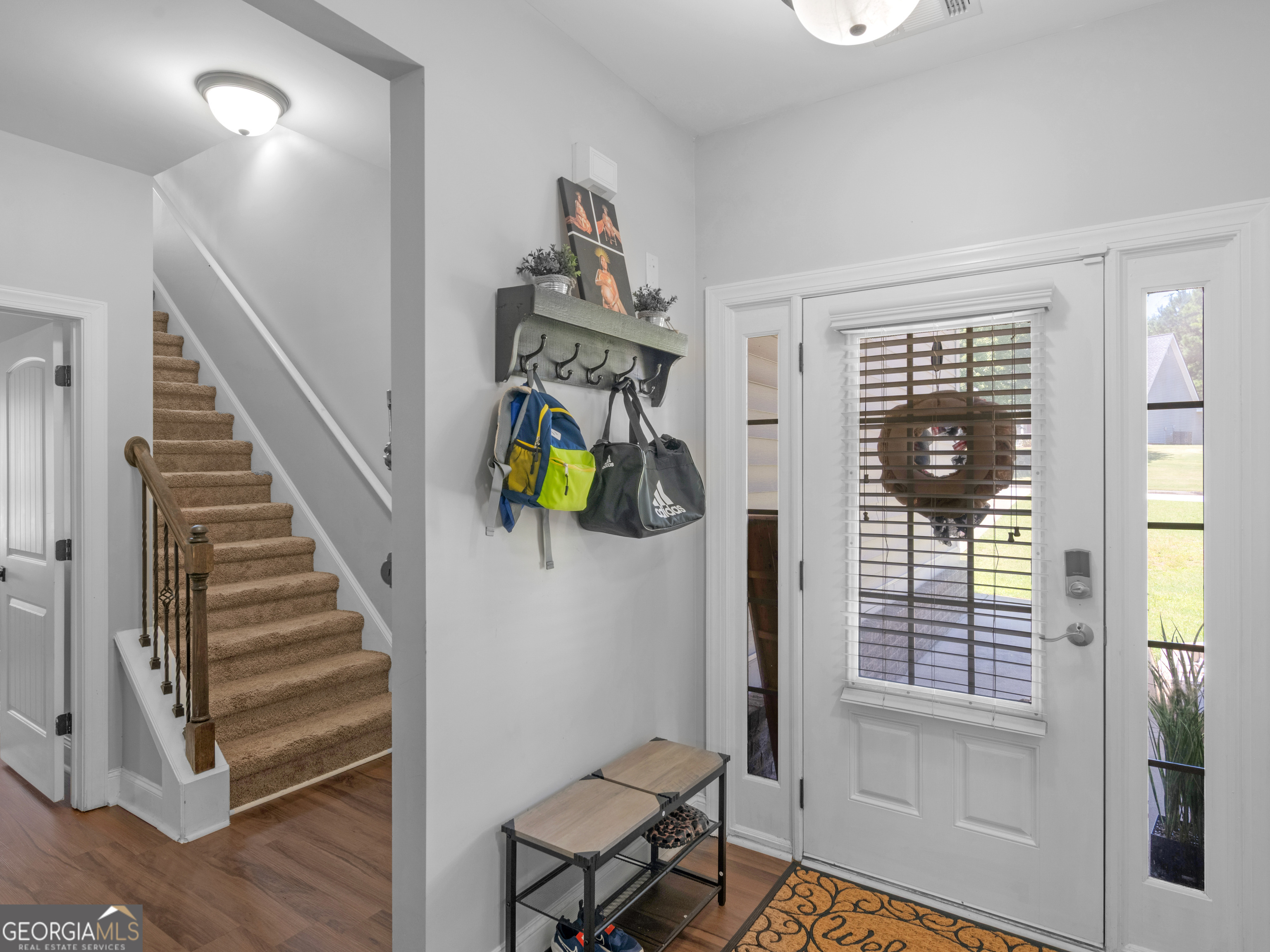 601 Amerigo Court Locust Grove, GA 30248 - Photo 2 of 23 a view of entryway and hall with wooden floor