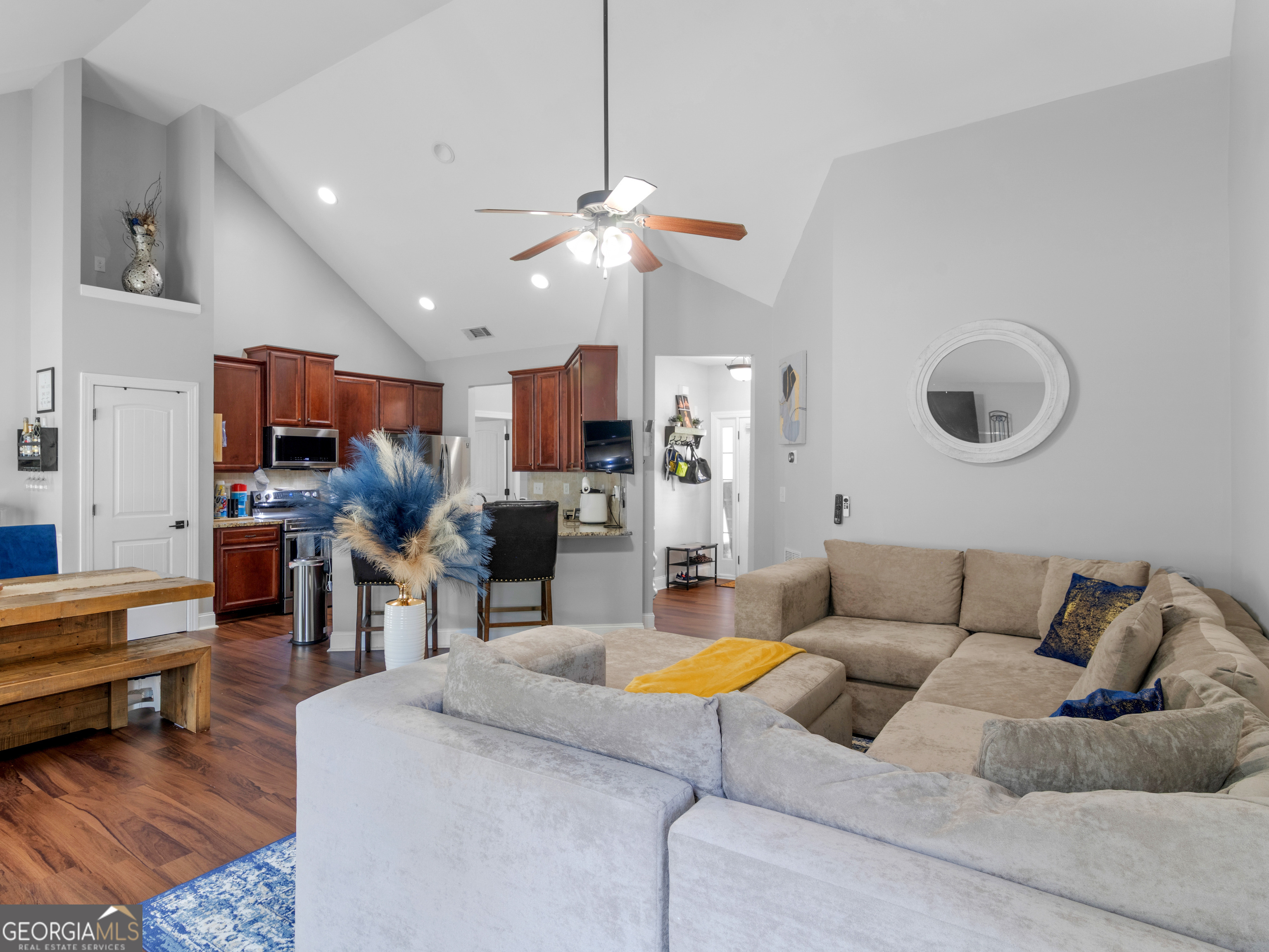 601 Amerigo Court Locust Grove, GA 30248 - Photo 3 of 23 a living room with furniture kitchen view and a chandelier