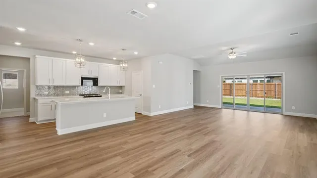 a view of kitchen with wooden floor