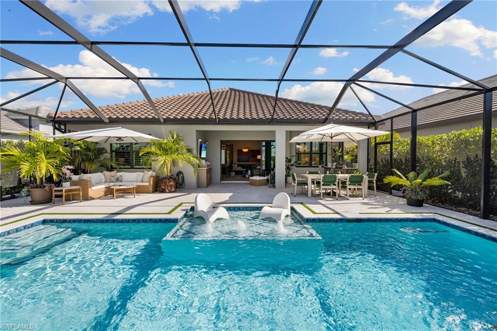 3967 Pegasus Way Naples, FL 34120 - Photo 33 of 50 a view of a swimming pool with a patio