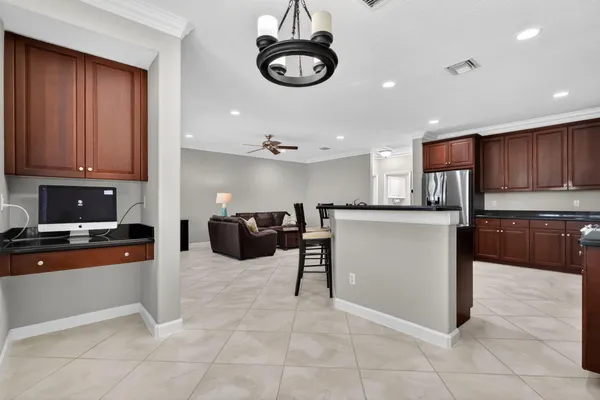 a kitchen with stainless steel appliances a stove a sink dishwasher and a refrigerator