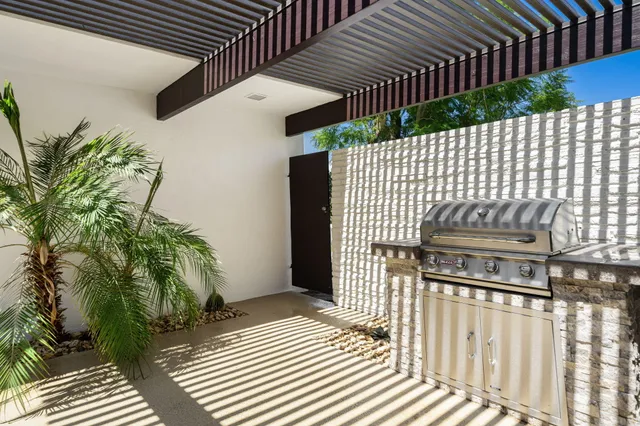 a view of a backyard with wooden fence