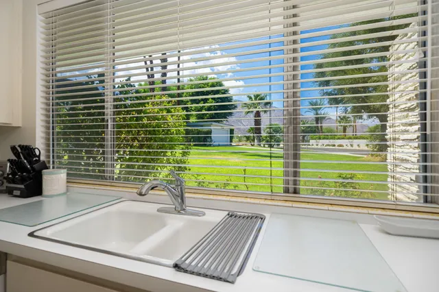 a bathroom with a sink and a large window