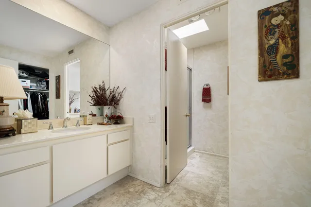 a bathroom with a double vanity sink and mirror