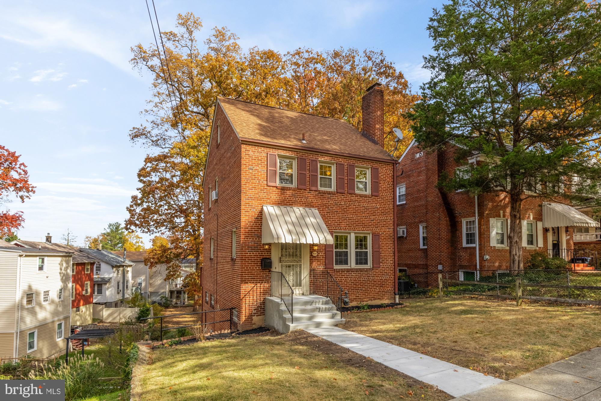3141 Central Avenue Northeast Washington, DC 20018 - Photo 1 of 38 a front view of a house with a yard