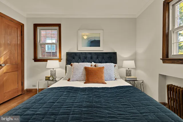 a bedroom with a large bed and a window