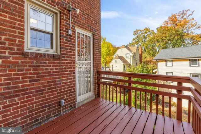 a view of wooden balcony with a potted plants