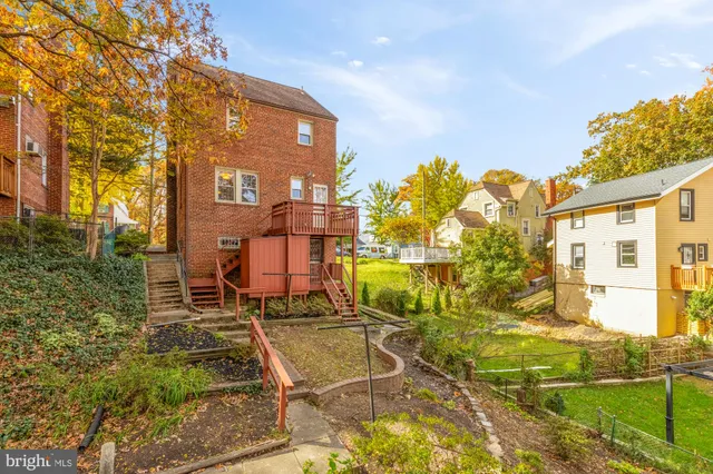 a view of a brick building next to a yard
