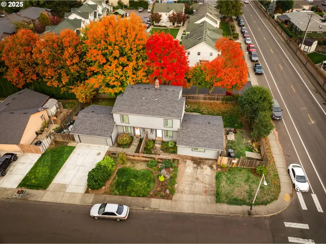 an aerial view of residential houses with outdoor space