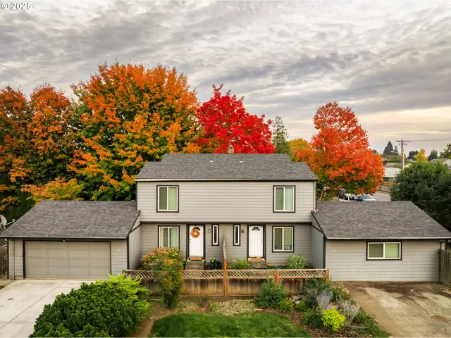a front view of a house with a garden