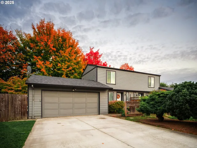 a front view of a house with a garage