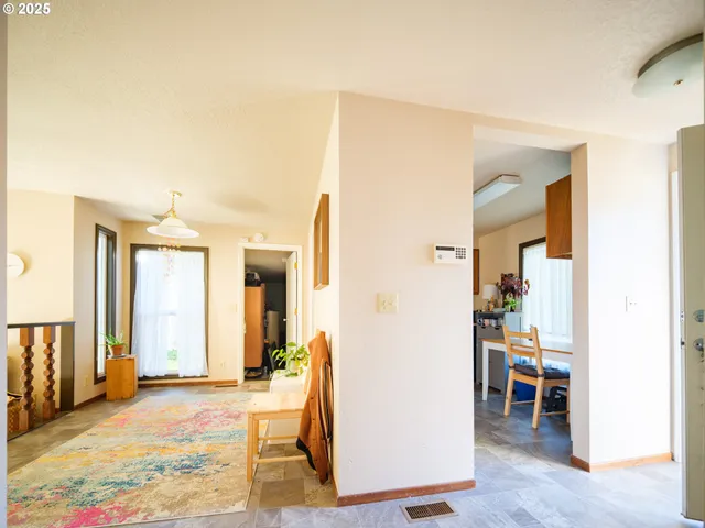 a view of a livingroom with furniture and front door
