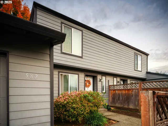 a front view of a house with a garage