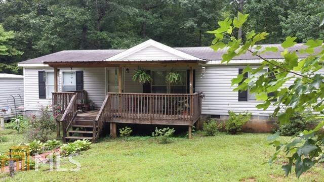 5269 Bevis Road Franklin, GA 30217 - Photo 1 of 1 a view of a deck that has a small yard and a garden