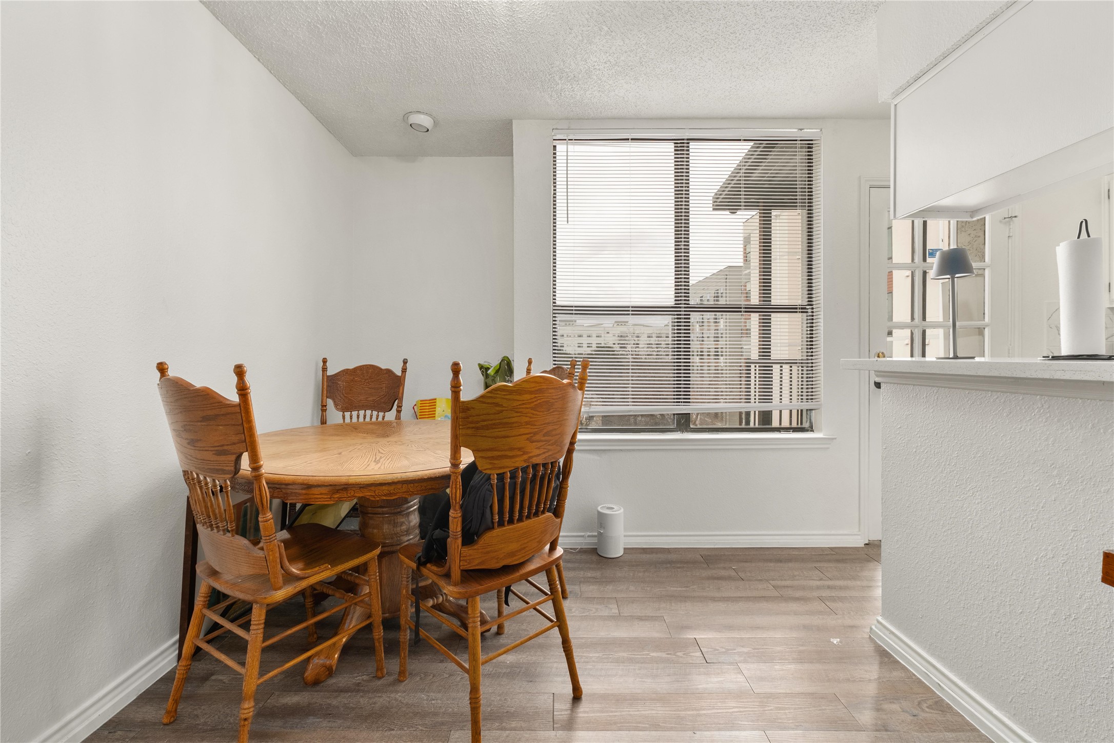 2409 Leon Street, Unit 307 Austin, TX 78705 - Photo 7 of 23 a view of a dining room with furniture and windows