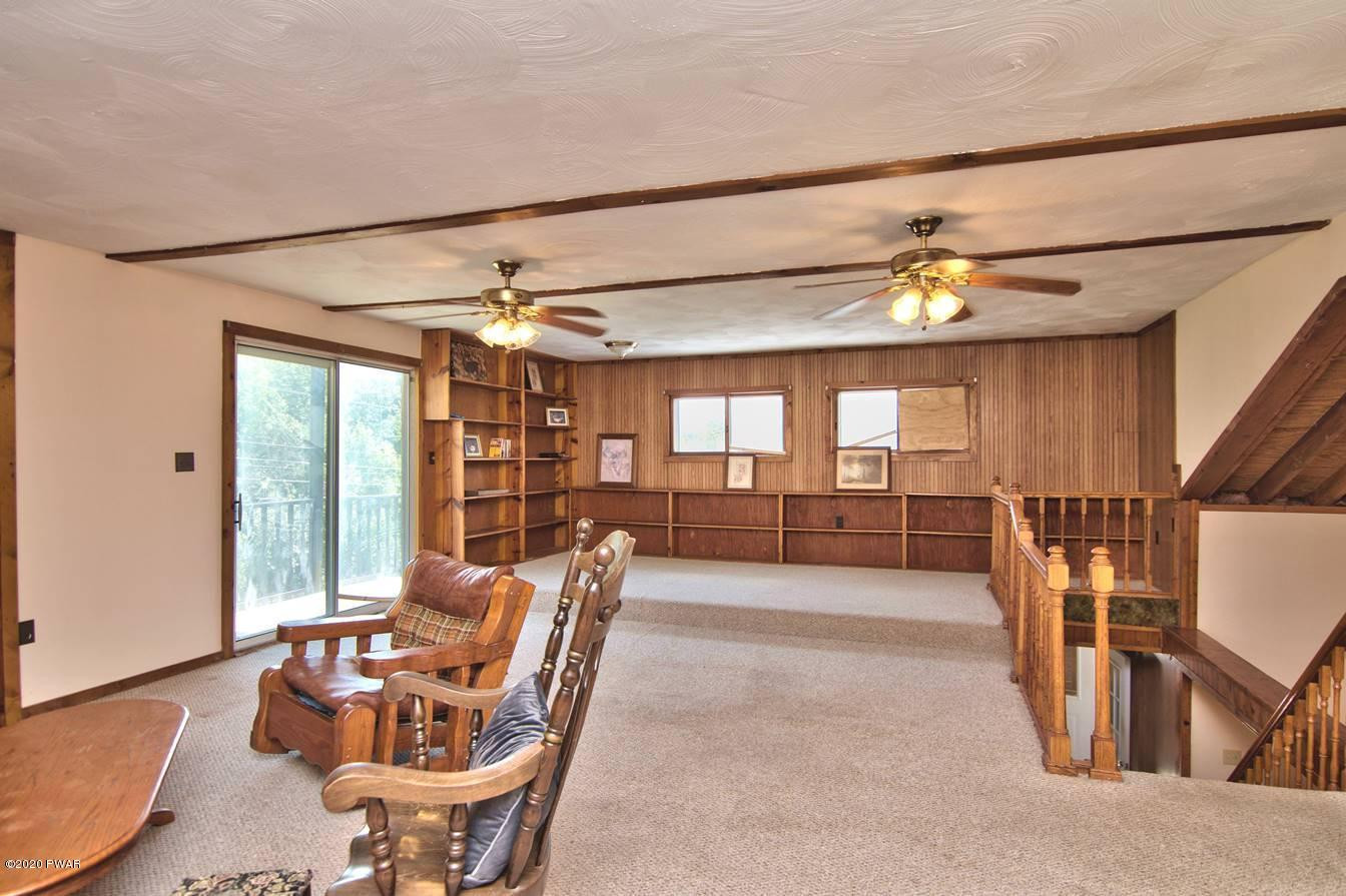 5690 Haas Pond Road Moscow, PA 18444 - Photo 44 of 79 a dining room with furniture and a chandelier