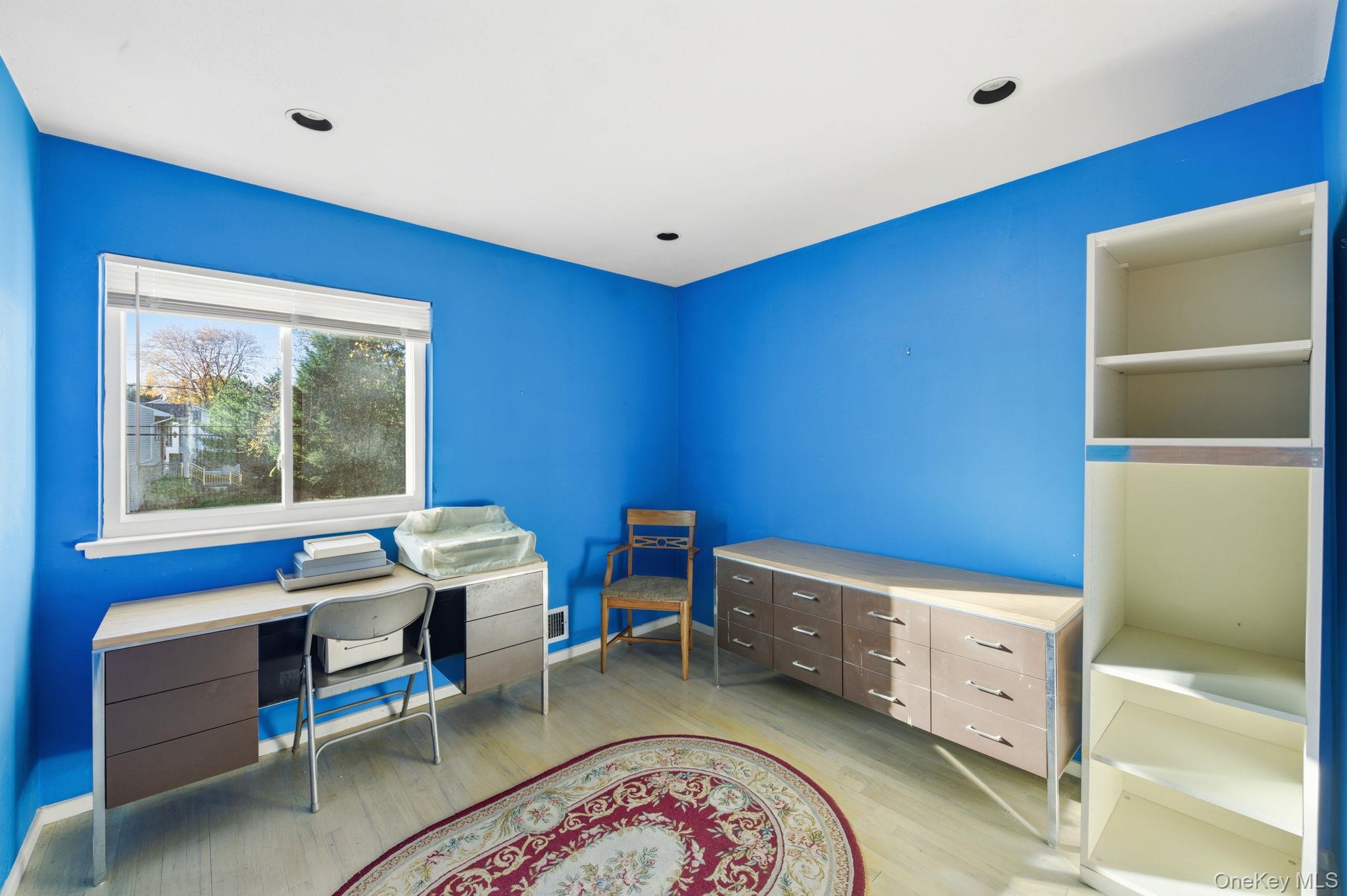 18 Dunhill Road Manhasset Hills, NY 11040 - Photo 11 of 20 a room with furniture and window