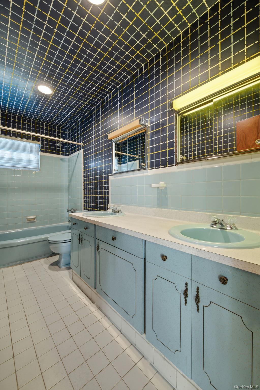 18 Dunhill Road Manhasset Hills, NY 11040 - Photo 12 of 20 a bathroom with a sink and a shower