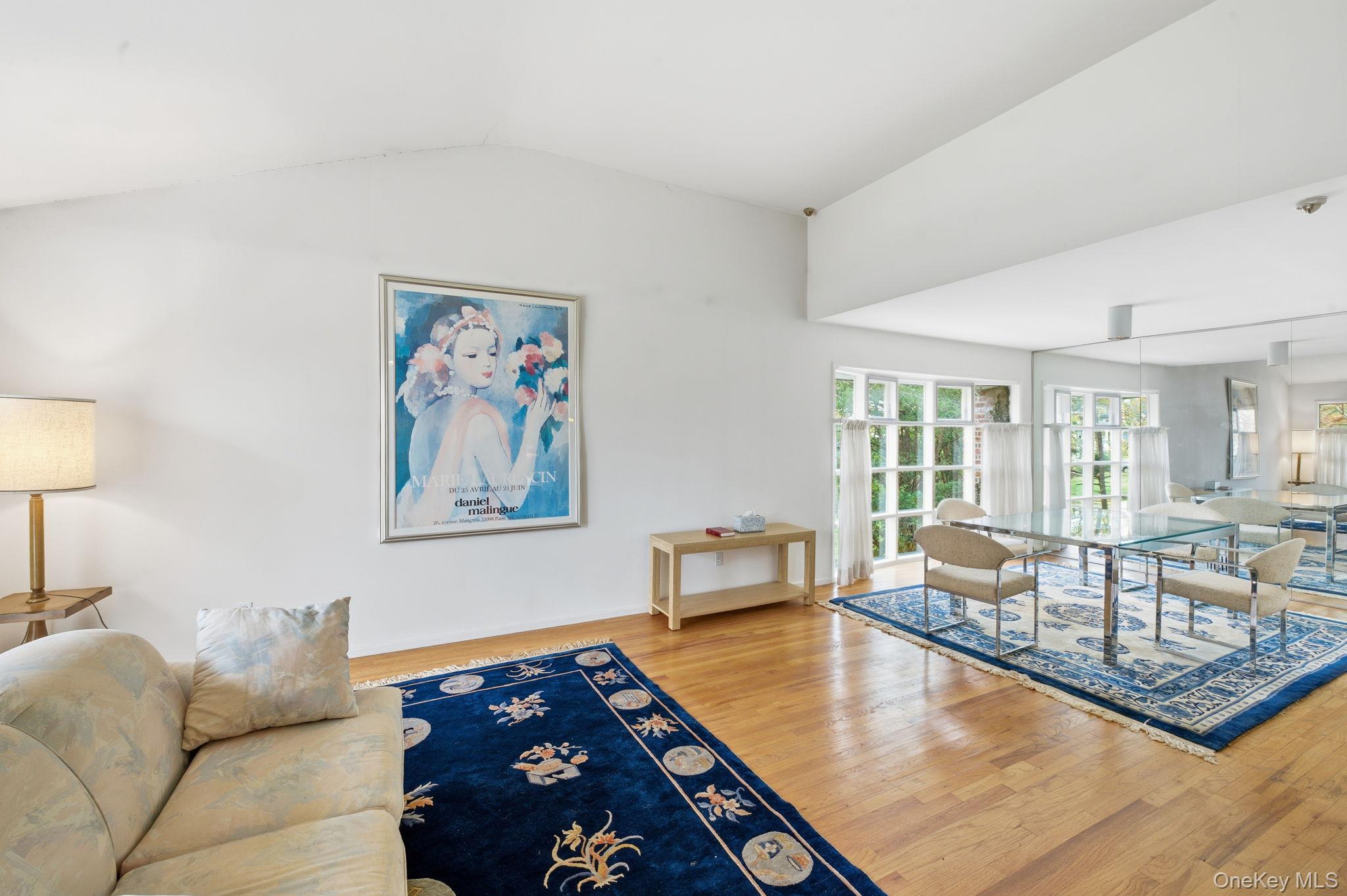 18 Dunhill Road Manhasset Hills, NY 11040 - Photo 4 of 20 a living room with furniture and a couch