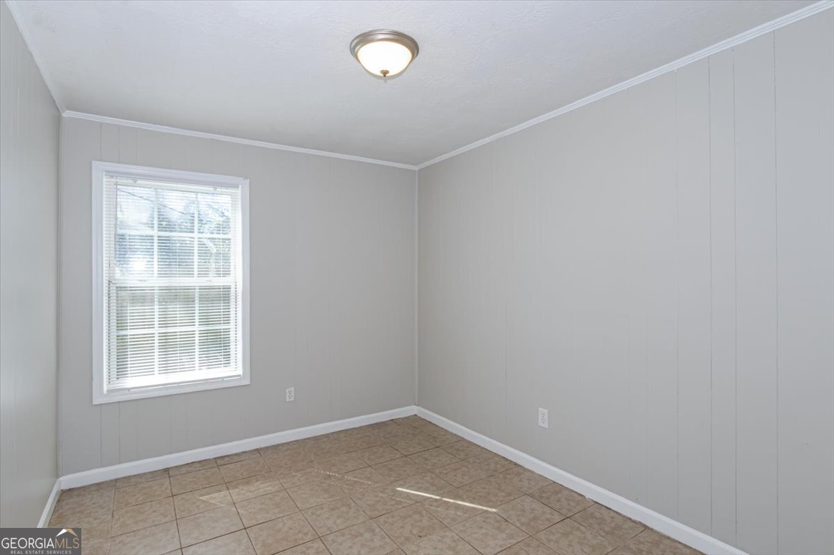 1232 12th Street, Unit B Augusta, GA 30901 - Photo 9 of 27 an empty room with a window