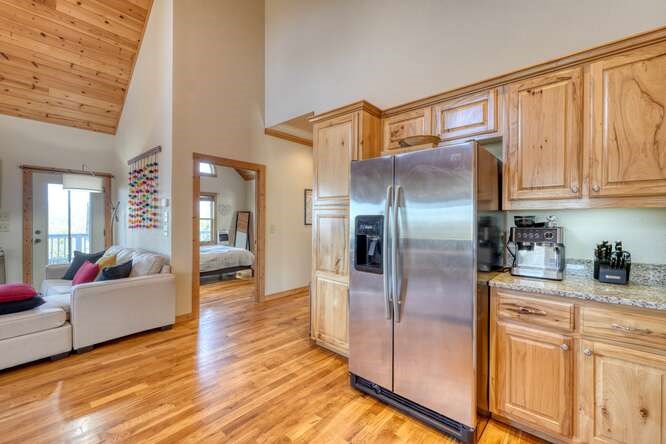 2081 Gallatin Road Young Harris, GA 30582 - Photo 12 of 44 a kitchen with stainless steel appliances granite countertop a refrigerator a stove and a refrigerator