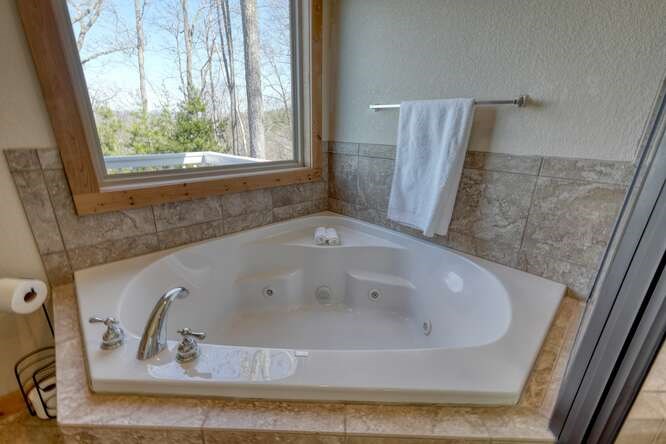 2081 Gallatin Road Young Harris, GA 30582 - Photo 18 of 44 a bath tub sitting next to a window