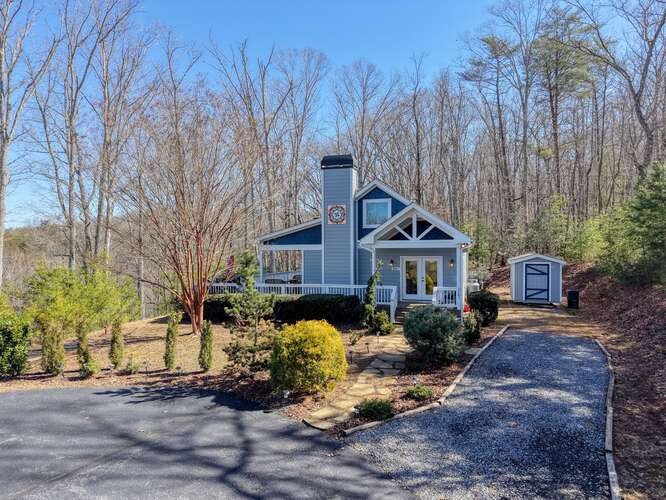 2081 Gallatin Road Young Harris, GA 30582 - Photo 2 of 44 a view of a house with a small yard and large trees
