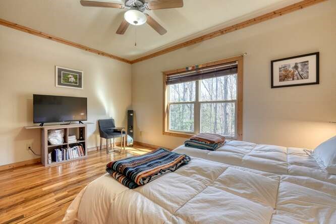 2081 Gallatin Road Young Harris, GA 30582 - Photo 22 of 44 a bedroom with a bed and a flat screen tv