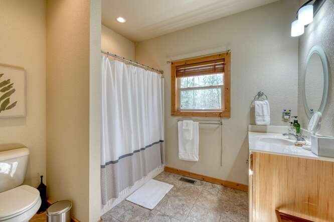 2081 Gallatin Road Young Harris, GA 30582 - Photo 23 of 44 a bathroom with a sink a toilet and shower