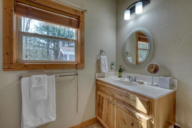 2081 Gallatin Road Young Harris, GA 30582 - Photo 24 of 44 a bathroom with a sink and a mirror