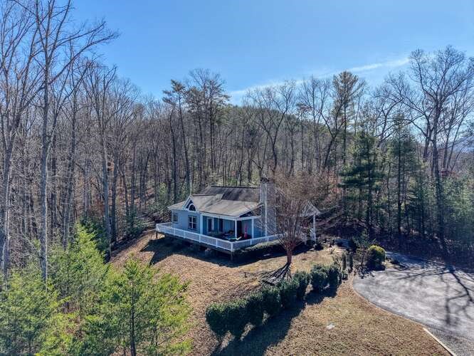 2081 Gallatin Road Young Harris, GA 30582 - Photo 36 of 44 a view of a chairs and fire pit in the middle of the yard