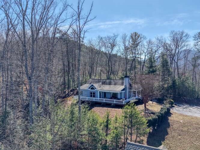 2081 Gallatin Road Young Harris, GA 30582 - Photo 39 of 44 a view of a house with a yard and sitting area