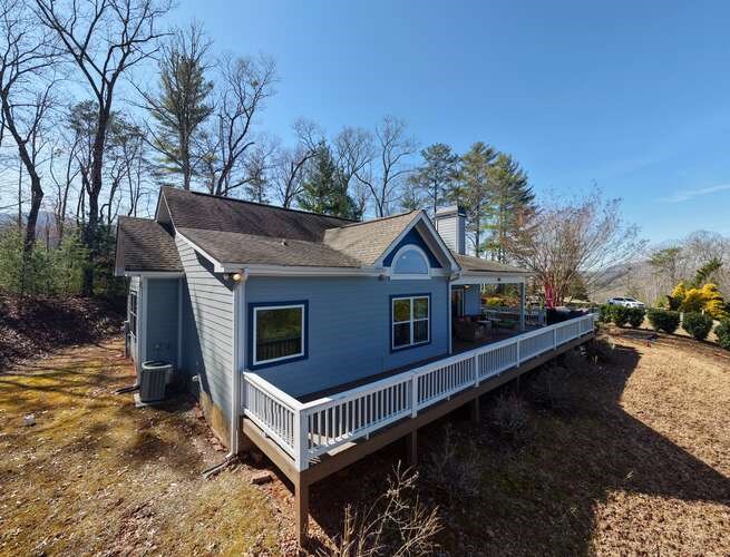 2081 Gallatin Road Young Harris, GA 30582 - Photo 40 of 44 a view of house with yard outdoor seating and covered with snow in the background