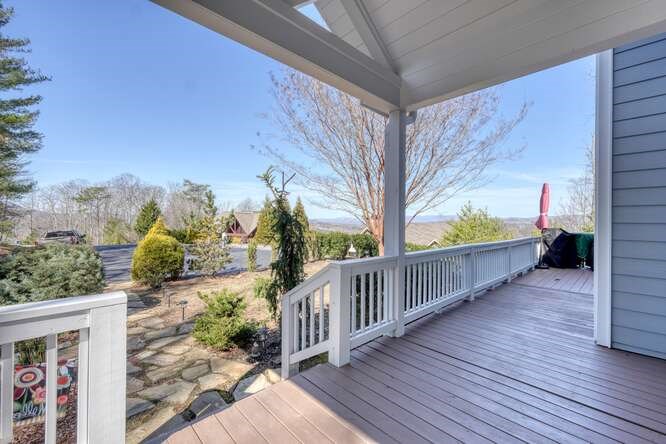 2081 Gallatin Road Young Harris, GA 30582 - Photo 4 of 44 a view of a porch with wooden floor and fence