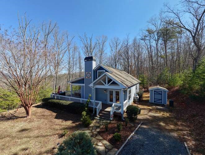 2081 Gallatin Road Young Harris, GA 30582 - Photo 41 of 44 a front view of a house with a yard covered with snow
