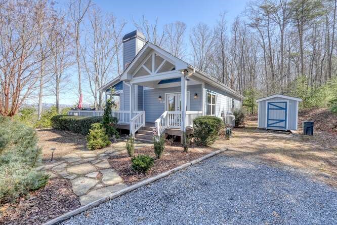 2081 Gallatin Road Young Harris, GA 30582 - Photo 43 of 44 a front view of a house with garden