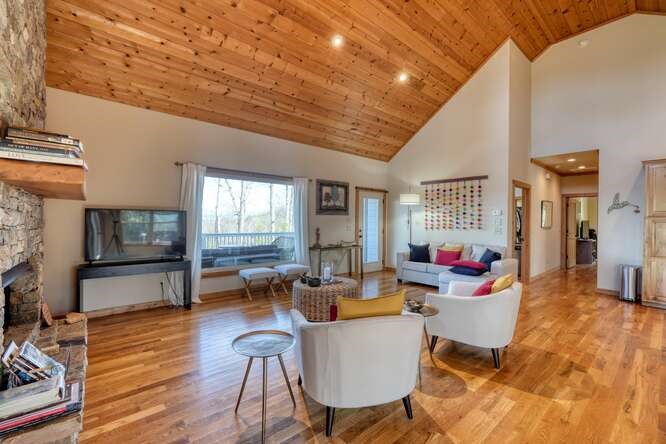 2081 Gallatin Road Young Harris, GA 30582 - Photo 5 of 44 a living room with furniture a window and wooden floor