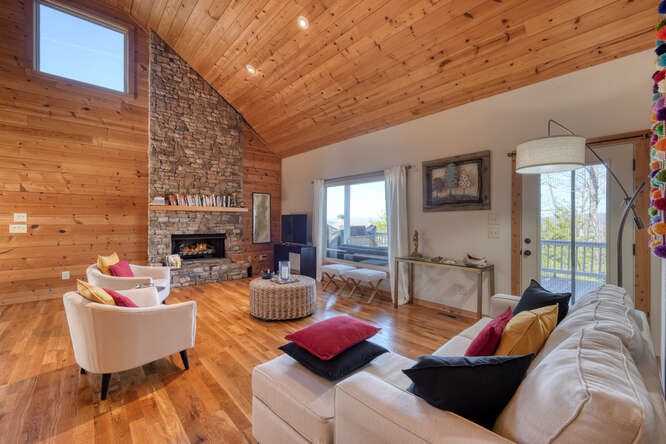 2081 Gallatin Road Young Harris, GA 30582 - Photo 7 of 44 a living room with furniture and a fireplace