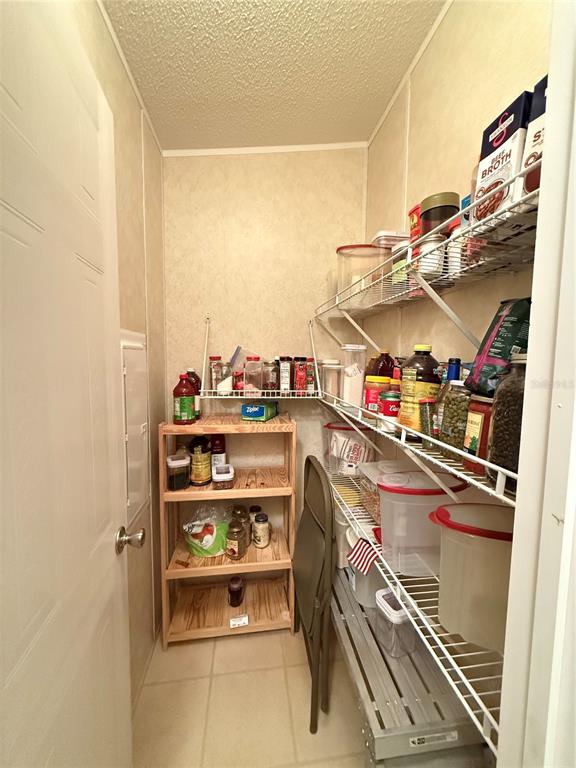 5109 Southwest 10th Street Bell, FL 32619 - Photo 29 of 38 a kitchen with a refrigerator and a stove