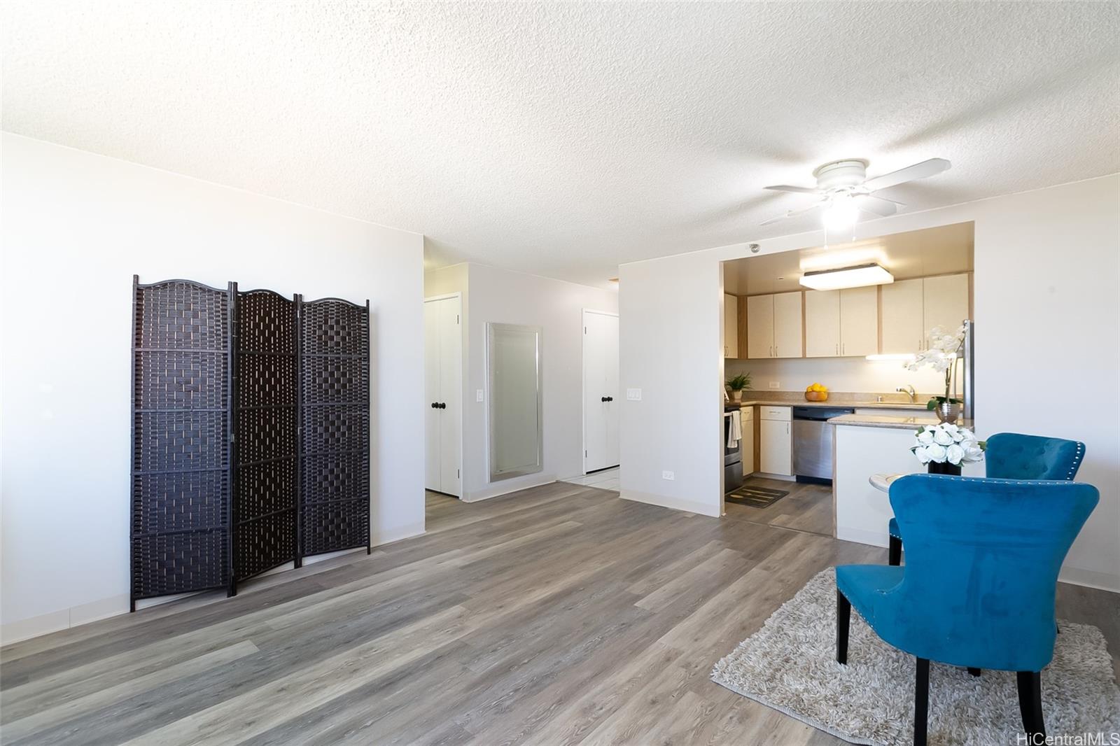 876 Curtis Street, Unit 1002 Honolulu, HI 96813 - Photo 1 of 1 a view of kitchen with refrigerator and cabinets